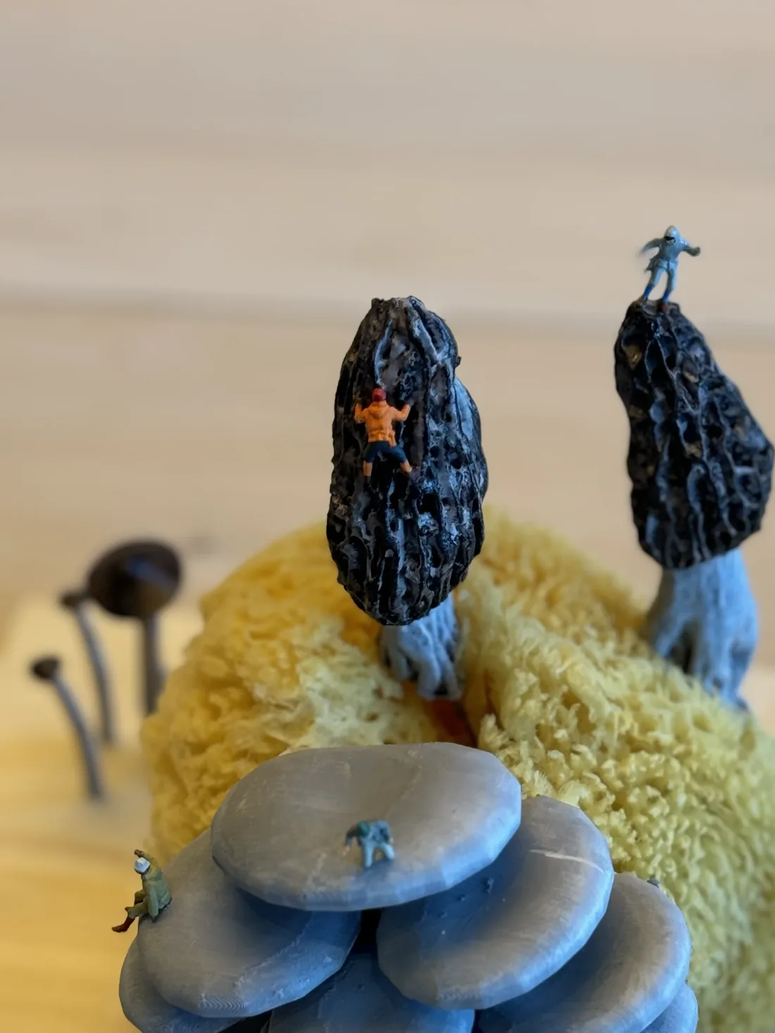 Tiny people climbing the mushrooms